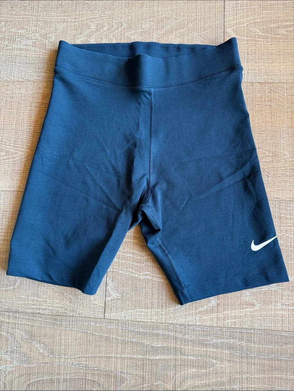 Nike women’s Marine Blue Bike Shorts with White Swoosh NWOT M